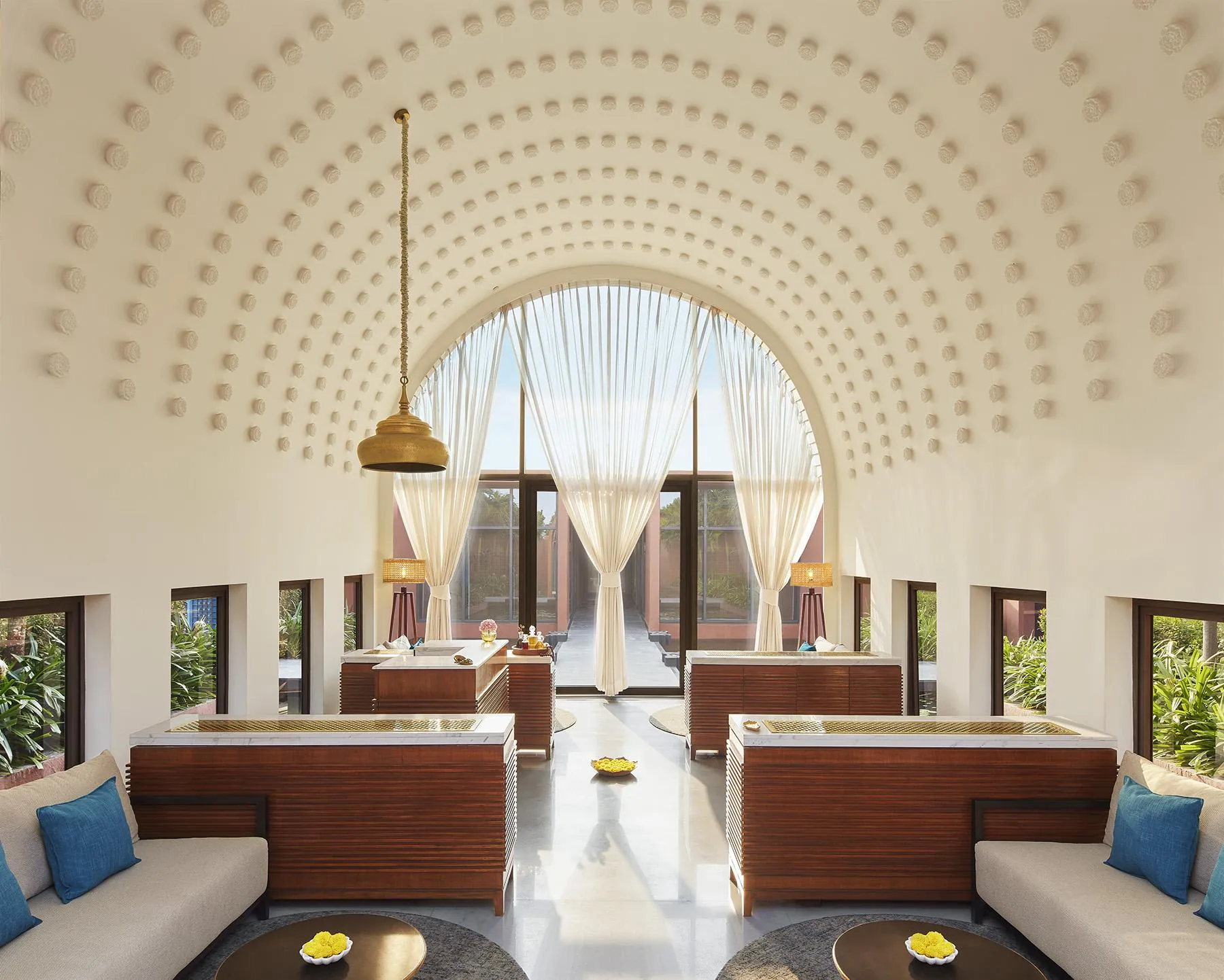 Light-filled lounge under a sculpted vaulted ceiling at Devasom