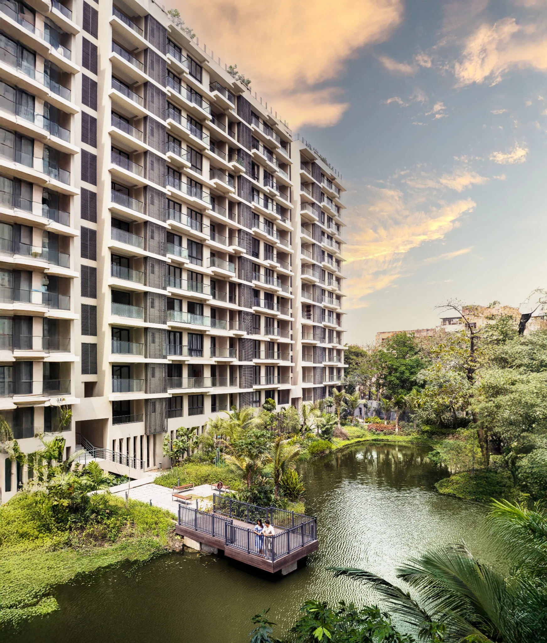 Continuous balconies overlooking the lake and waterfront pavilion at Jiva Homes