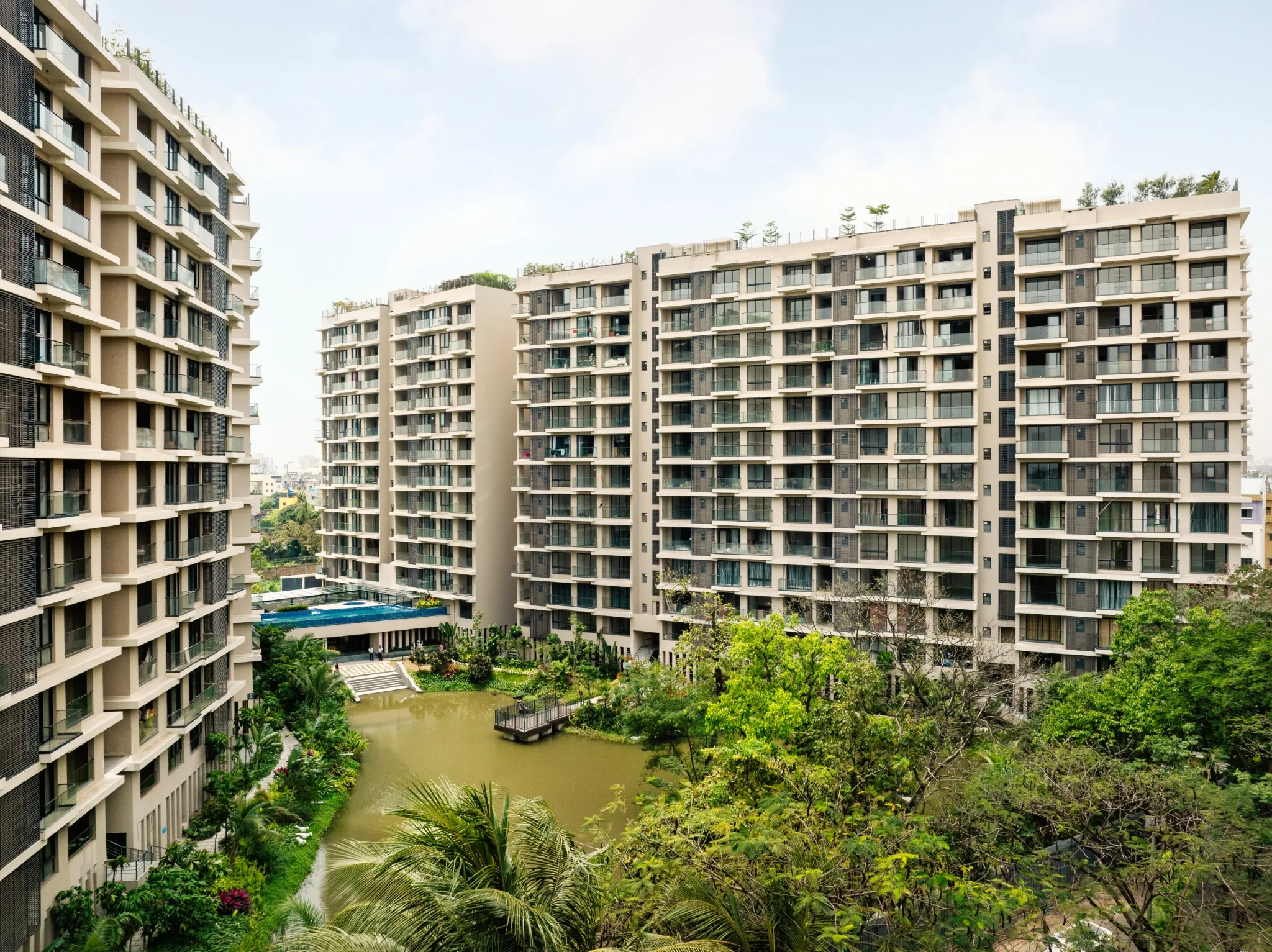 Residential blocks enclosing the lake and courtyard landscape at Jiva Homes