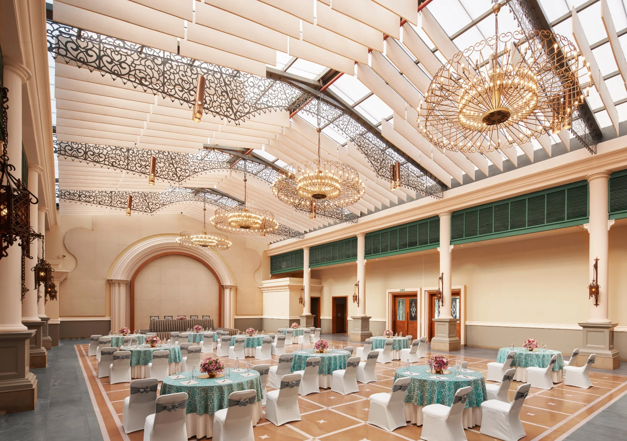 Raas Manch banquet hall with chandeliers and a light-filled ceiling at IHCL SeleQtions – Raajkutir, Kolkata