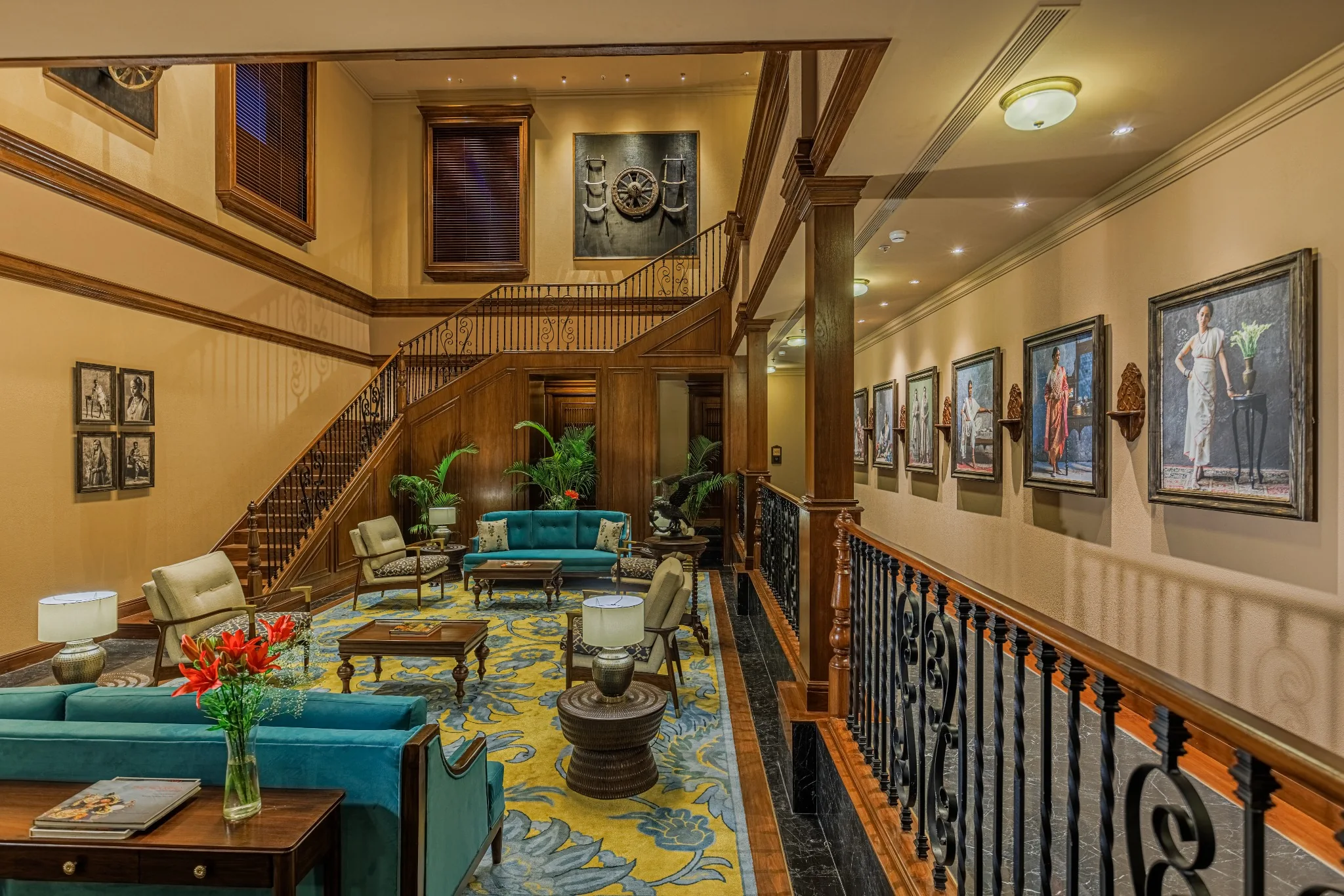 Timber staircase, portrait gallery and lounge seating at Serai Block, Kolkata