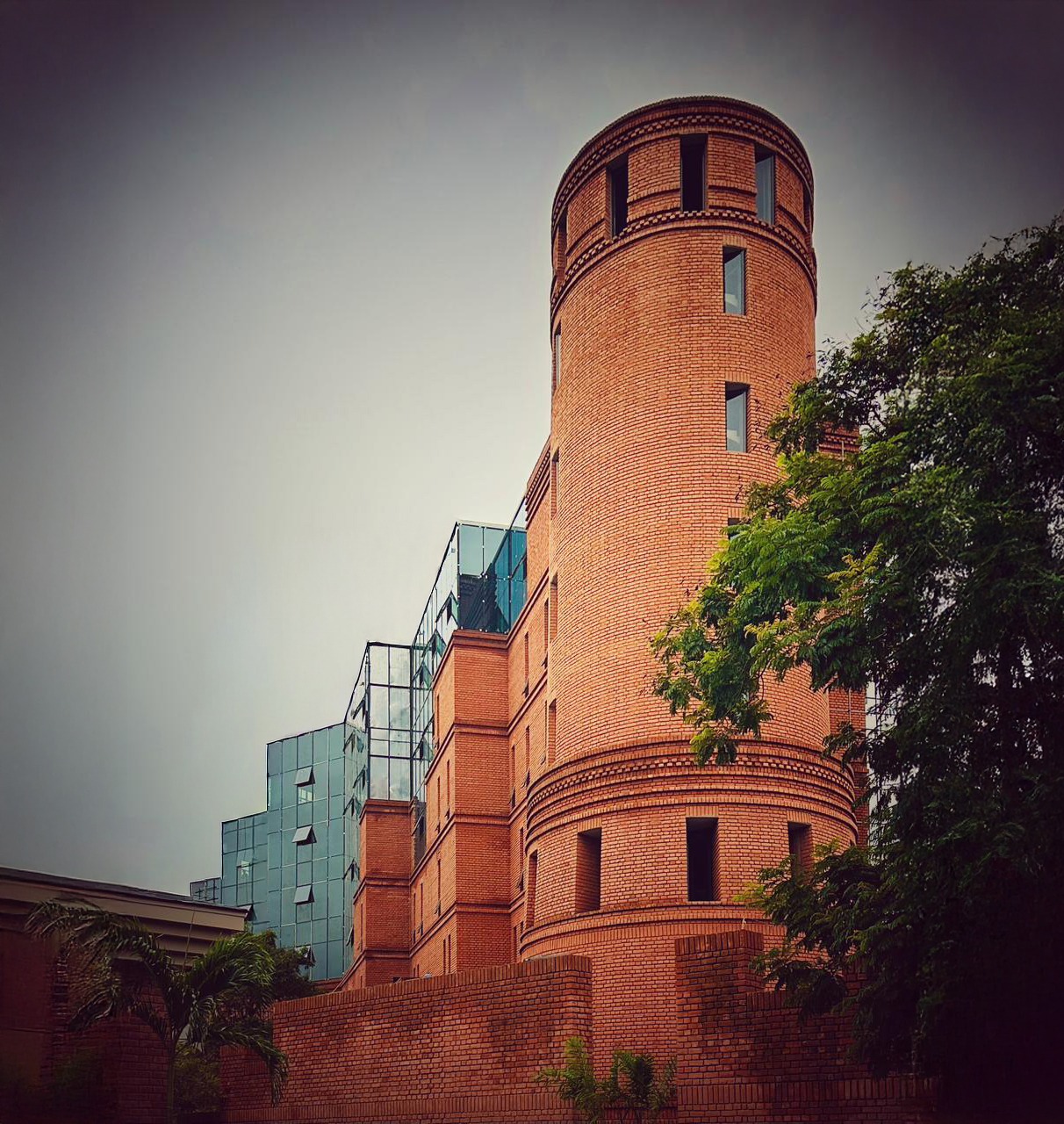 Brick tower and glazed volumes
