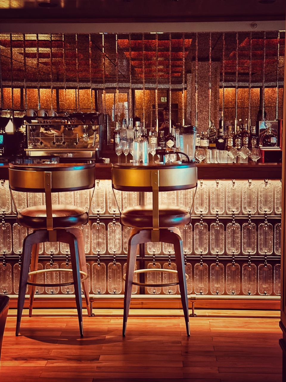 Backlit bar and bespoke stools